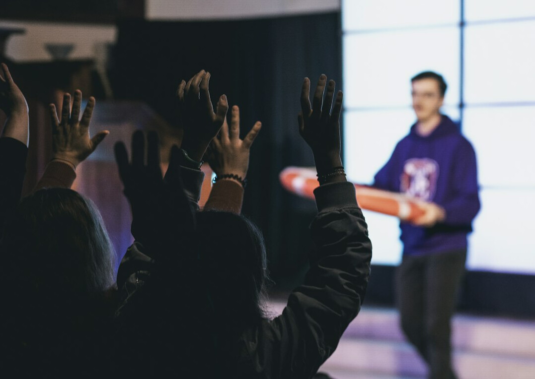 confident person speaking in front of audience